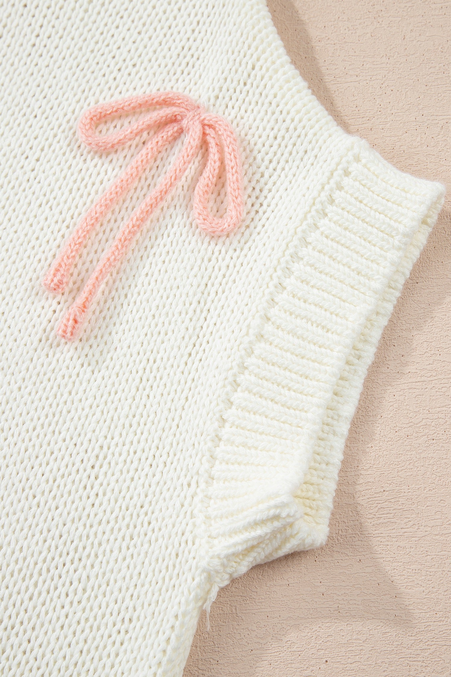 White knit bow sweater
